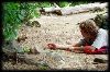 My son tempting a red squirrel while we wait for our tow back.