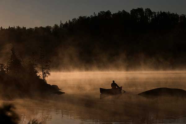 Canoe in the mist - Boundary Waters