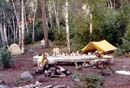 Favorite campsite activities, 1988, Back Bay.<BR>The only trip with our children, ages 16 and 18. Spartan1 playing<BR> with a fire, Ed training for Cross Country,<BR> MH reading a book, and Spartan2 photographing.